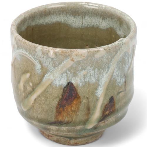 214 - TAKESHI YASUDA (born 1943); a stoneware yunomi , with ash and chun glaze and raised slip decoration,... 