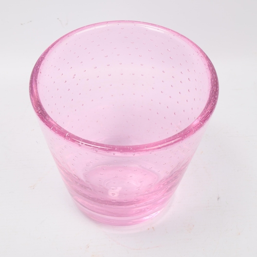 239 - MARJA HEPO-AHO, Finland, a small vase in pink glass with controlled bubbles produced with a hedgehog... 