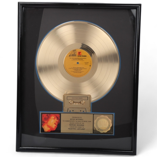 JIMI HENDRIX EXPERIENCE a GOLD DISC presented to MITCH MITCHELL to Commemorate The Sale of More Than 500,000 Copies Sold of the 1968 Album 'Electric Ladyland'. A Certified RIAA Sales Award.