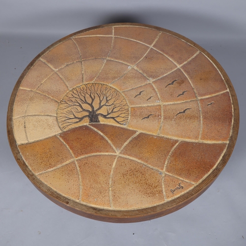 290 - BARROIS, Valllauris, France, a 1960s'/70s' round tile-top coffee table, with stained beech plywood f... 