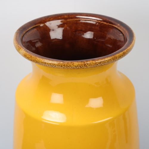 329 - A vintage West German fat lava floor vase by Scheurich, with smooth yellow glaze to top half, number... 