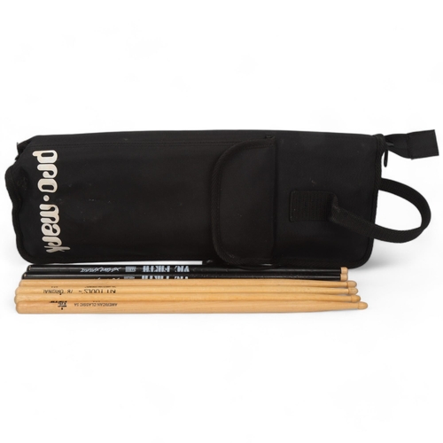 66 - A PRO-MARK STICKBAG containing six drumsticks. Two VIC FIRTH American Classic 5As (unused), two KIT ... 