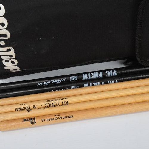 66 - A PRO-MARK STICKBAG containing six drumsticks. Two VIC FIRTH American Classic 5As (unused), two KIT ... 