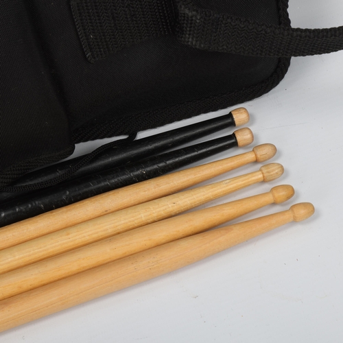 66 - A PRO-MARK STICKBAG containing six drumsticks. Two VIC FIRTH American Classic 5As (unused), two KIT ... 