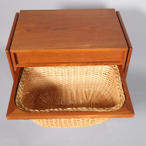 80 - A Mid 20th Century teak sewing trolley/sewing table, with fitted drawer and rattan basket under top,... 