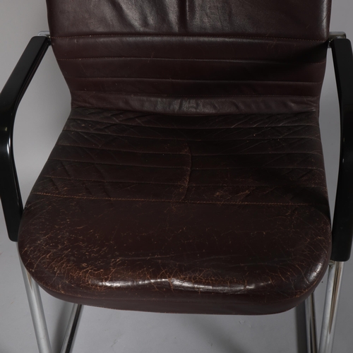 82 - An mid 20th century cantilever office chair, heavy tubular steel frame with padded leather upholster... 