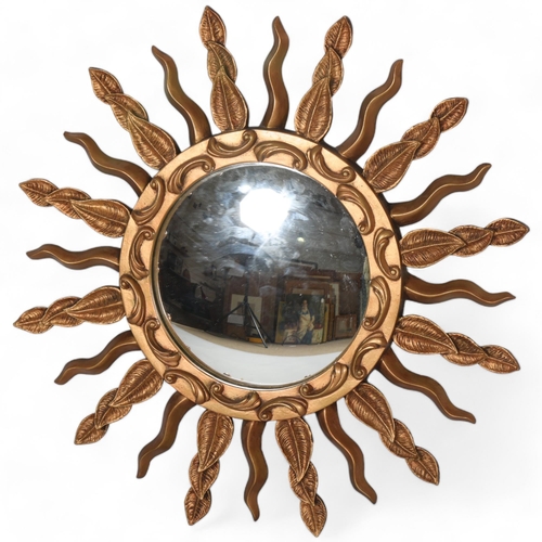 89 - A mid 20th century convex sunburst mirror, signed to rim STALUC, diameter 57cm