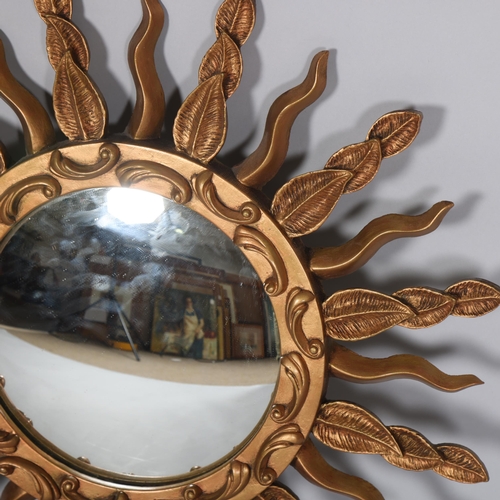 89 - A mid 20th century convex sunburst mirror, signed to rim STALUC, diameter 57cm