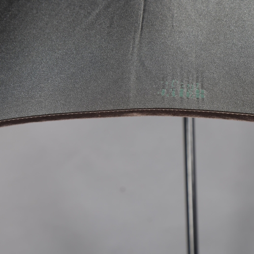 90 - A JEAN PAUL GAULTIER designer umbrella, with ebonised wood stem and silvered fabric, length 90cm