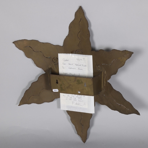 91 - CATHERINE PURVES, a hand made brass star-shaped wall light, with original receipt from Dazzle exhibi... 