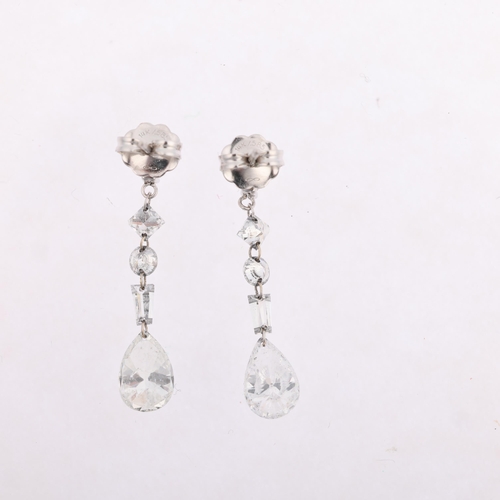 1107 - A pair of 14ct white gold vari-cut diamond drop earrings, London 2010, each earring with trillion-cu... 