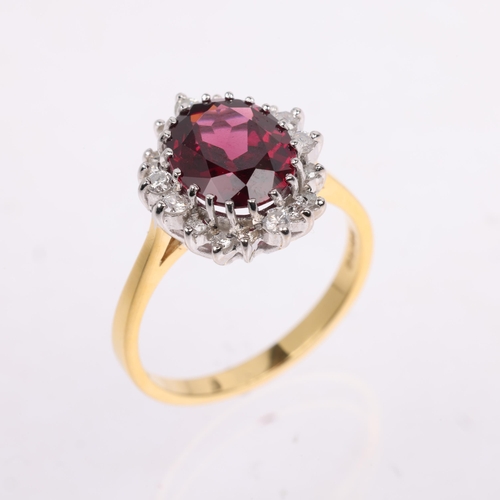 1123 - A late 20th century 18ct gold almandine garnet and diamond oval cluster ring, maker R Ltd, London 19... 