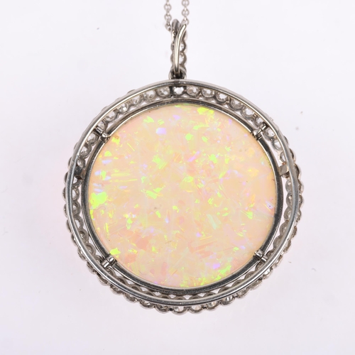 1125 - A Belle Epoque opal and diamond cluster pendant necklace, rub-over set with 15ct round cabochon opal... 