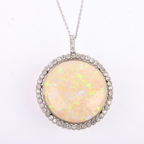 1125 - A Belle Epoque opal and diamond cluster pendant necklace, rub-over set with 15ct round cabochon opal... 