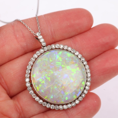 1125 - A Belle Epoque opal and diamond cluster pendant necklace, rub-over set with 15ct round cabochon opal... 