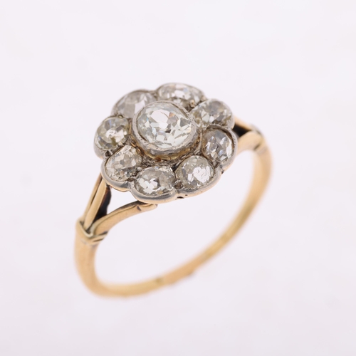 1128 - An 18ct gold diamond flowerhead cluster ring, rub-over set with old-cut diamonds, total diamond cont... 