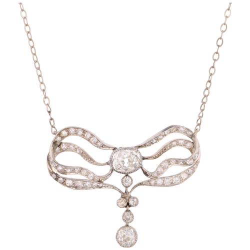 1129 - An Art Nouveau French diamond ribbon bow pendant necklace, circa 1910, set with old and eight-cut di... 