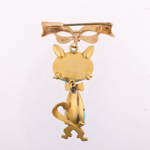 1131 - A mid-20th century Italian 18ct gold blue glass figural cat brooch, by Carl Art, circa 1960s, with l... 