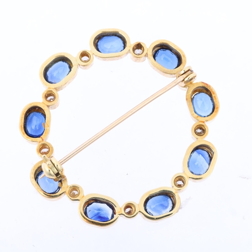 1138 - A late 20th century sapphire and diamond wreath brooch, rub-over set with modern round brilliant-cut... 