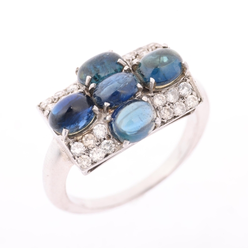 1139 - A sapphire and diamond cross cluster panel ring, in the Art Deco style, set with oval cabochon sapph... 