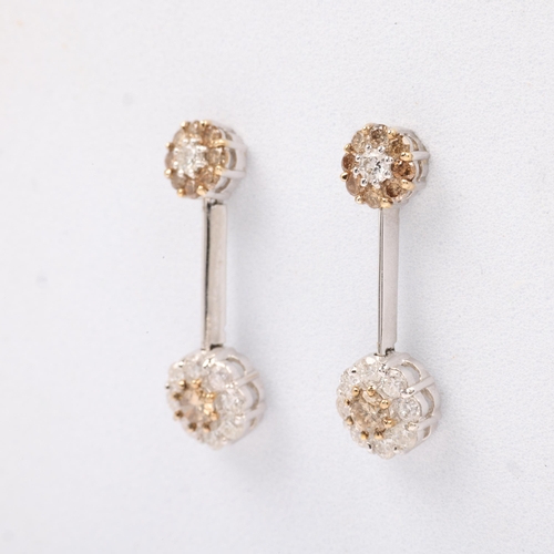 1142 - A pair of 18ct white gold champagne diamond and diamond flowerhead cluster drop earrings, set with m... 