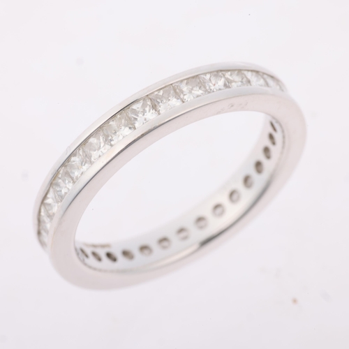 1143 - An 18ct white gold diamond full eternity band ring, maker SG, channel set with Princess-cut diamonds... 