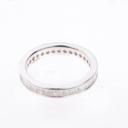 1143 - An 18ct white gold diamond full eternity band ring, maker SG, channel set with Princess-cut diamonds... 