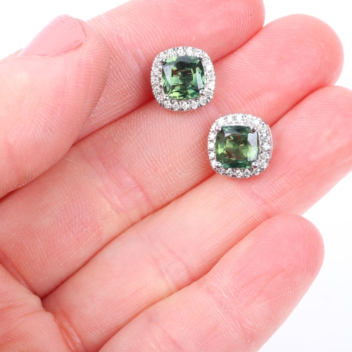 1145 - A pair of 9ct white gold demantoid garnet and diamond square cluster earrings, set with modern round... 