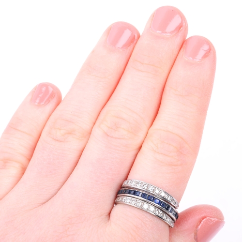 1147 - An Art Deco 'Day And Night' swivel eternity ring, half of central band channel set with calibre-cut ... 