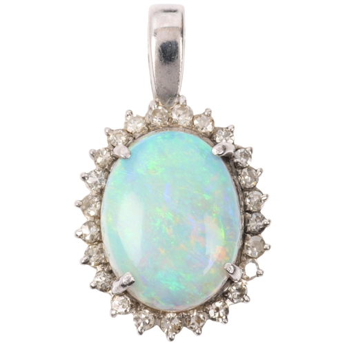 1148 - A late 20th century opal and diamond oval cluster pendant, claw set with 3ct oval cabochon opal surr... 