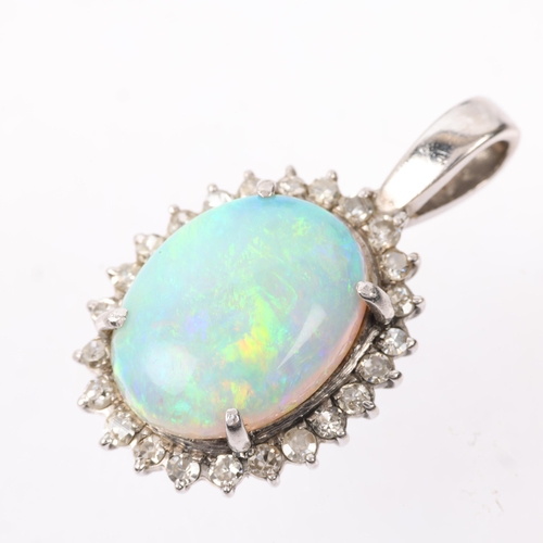 1148 - A late 20th century opal and diamond oval cluster pendant, claw set with 3ct oval cabochon opal surr... 