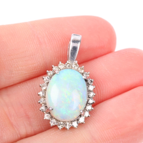 1148 - A late 20th century opal and diamond oval cluster pendant, claw set with 3ct oval cabochon opal surr... 