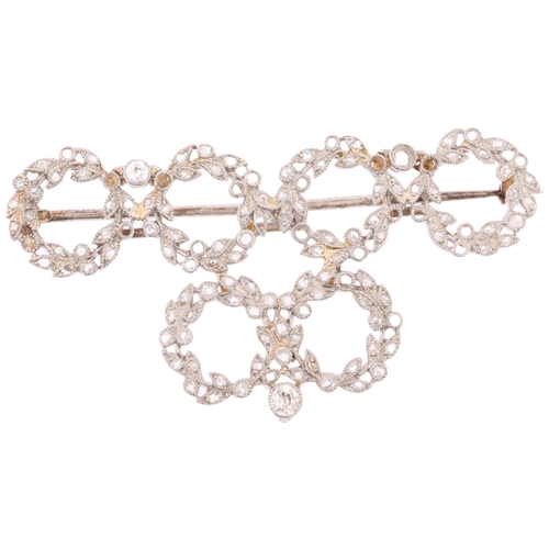 1153 - A Belle Epoque diamond wreath brooch, circa 1910, millegrain set with old European and rose-cut diam... 