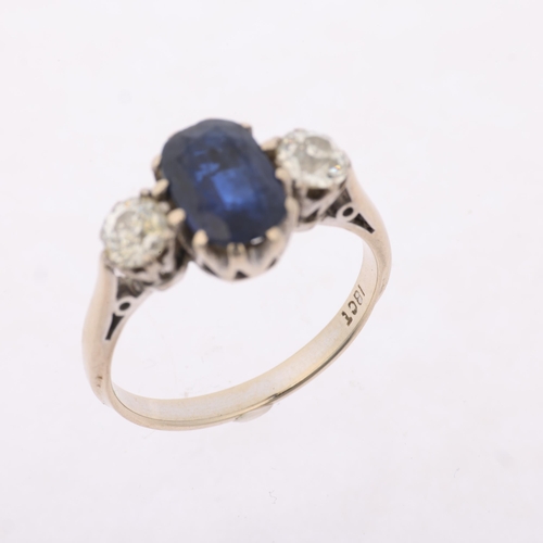 1159 - An 18ct white gold three stone sapphire and diamond ring, claw set with 1.7ct oval mixed-cut sapphir... 