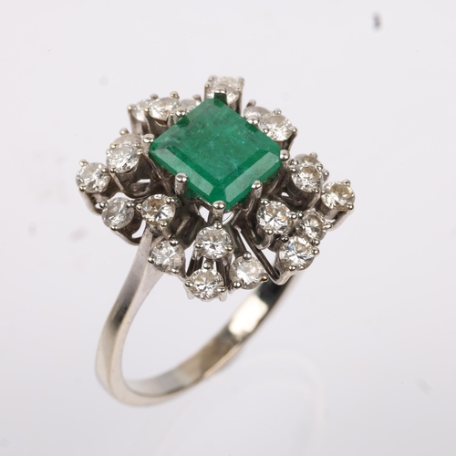 1162 - A late 20th century 18ct white gold emerald and diamond cluster cocktail ring, centrally claw set wi... 