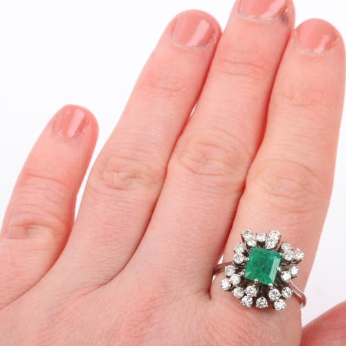 1162 - A late 20th century 18ct white gold emerald and diamond cluster cocktail ring, centrally claw set wi... 