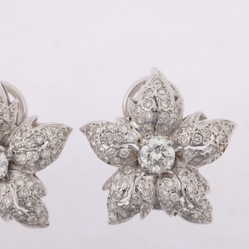 1170 - A pair of 14ct white gold diamond flowerhead cluster earrings, set with modern round brilliant-cut d... 