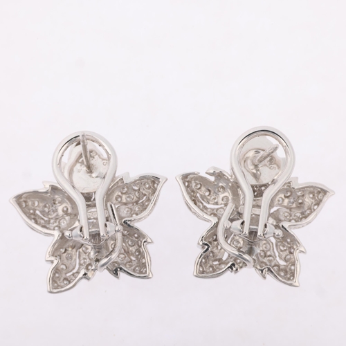 1170 - A pair of 14ct white gold diamond flowerhead cluster earrings, set with modern round brilliant-cut d... 