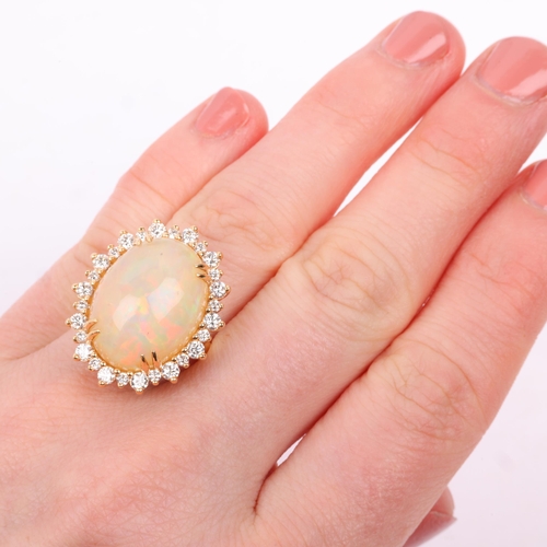 1171 - An impressive 18ct gold Ethiopian opal and diamond oval cluster ring, centrally double claw set with... 