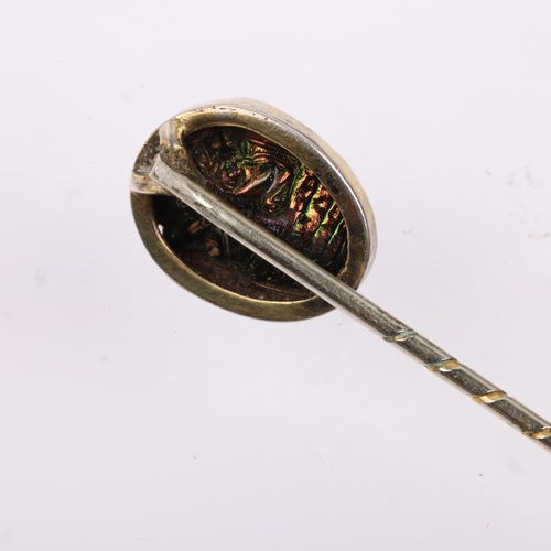 1175 - An Egyptian Revival scarab beetle stickpin, in gilt-metal setting, head 14.1mm, overall 64.9mm, 1.4g