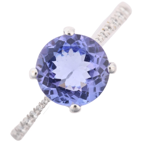 1234 - An 18ct white gold tanzanite and diamond dress ring, claw set with round-cut tanzanite and modern ro... 