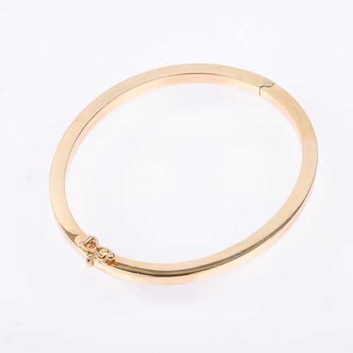 1237 - A 9ct gold plain hinged bangle, band width 4.1mm, internal circumference 18cm, 10.7g