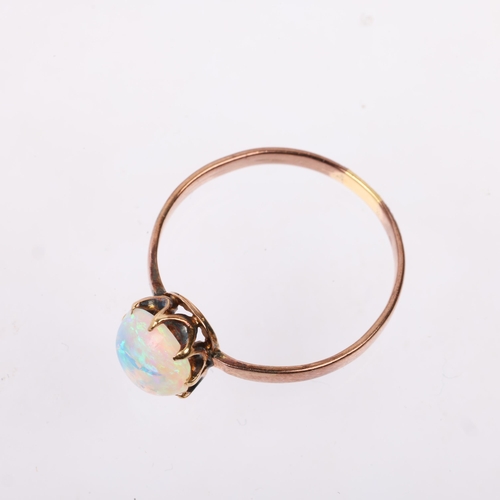 1238 - An early 20th century solitaire opal ring, claw set with 1ct oval cabochon opal, opal measures appro... 