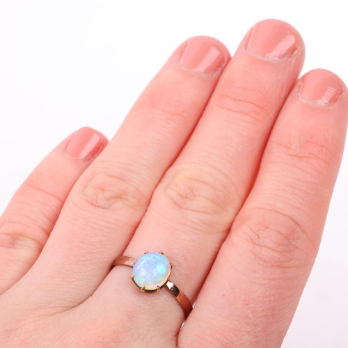 1238 - An early 20th century solitaire opal ring, claw set with 1ct oval cabochon opal, opal measures appro... 