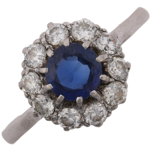 1242 - A mid-20th century platinum sapphire and diamond flowerhead cluster ring, claw set with round-cut sa... 