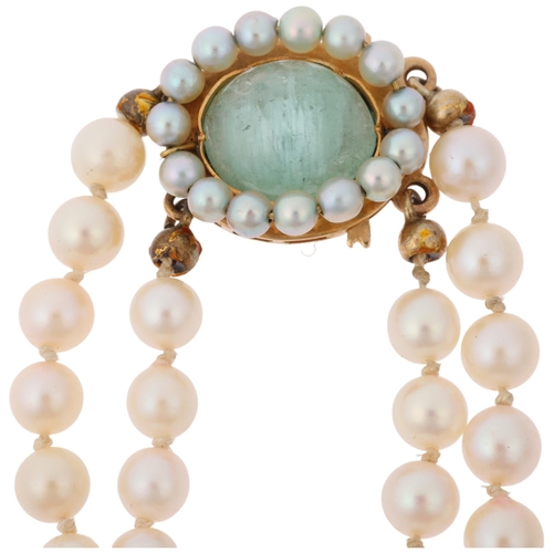 1246 - A Swedish double-strand graduated pearl bead necklace, maker AEN, circa 1964, with 18ct gold cats ey... 