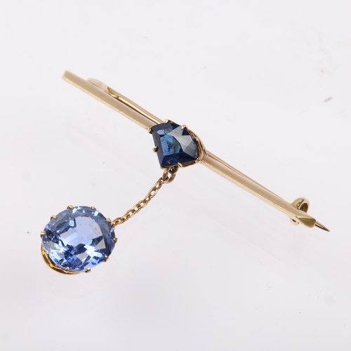 1250 - An early 20th century sapphire drop bar brooch, claw set with triangular segment-cut sapphire suspen... 