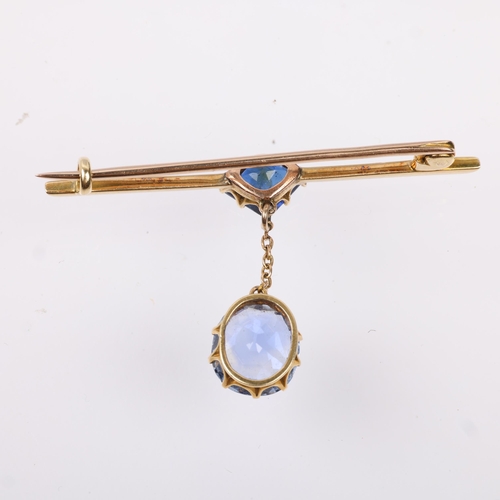 1250 - An early 20th century sapphire drop bar brooch, claw set with triangular segment-cut sapphire suspen... 