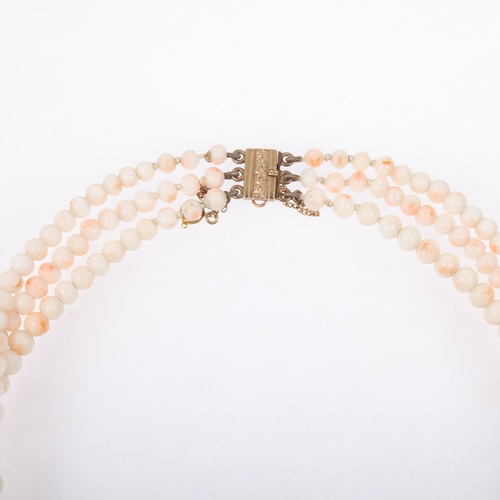 1252 - A Vintage triple-strand graduated 'Angel Skin' coral bead necklace, with 9ct gold clasp, coral beads... 