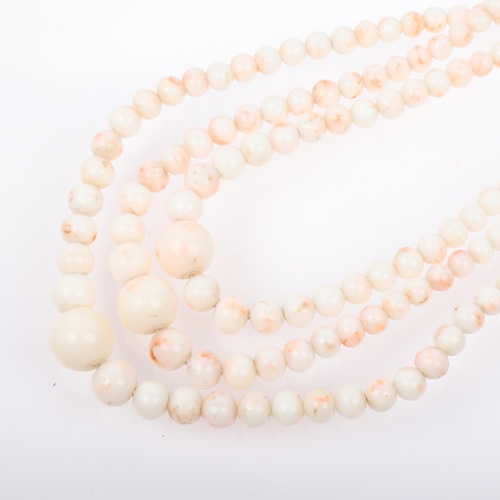 1252 - A Vintage triple-strand graduated 'Angel Skin' coral bead necklace, with 9ct gold clasp, coral beads... 